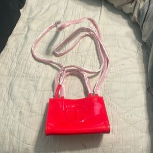 Small red patent bag
